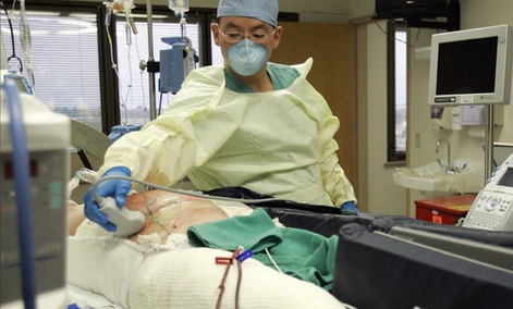 Dr. Kevin Chung treats a burn patient at Brooke Army Medical Center in San Antonioin 2007. Dr. Kevin Chung treats a burn patient at Brooke Army Medical Center in San Antonioin 2007.