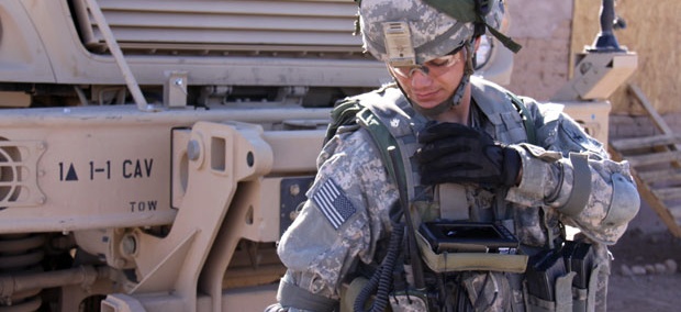 A soldier uses a JTRS Rifleman Radio during a network evaluation exercise in 2011. 