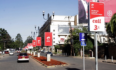 Nairobi streets are adorned with mobile phone ads. Nairobi streets are adorned with mobile phone ads.