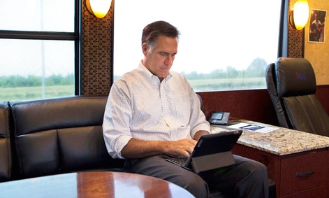 Mitt Romney works on an iPad while campaigning. Mitt Romney works on an iPad while campaigning.