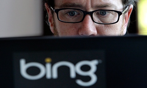 Microsoft vendor Patrick Porter works on a laptop marked with the logo for Bing, the company's search engine.