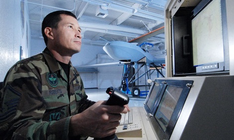 Master Sgt. Fred Roberts uses a maintenance interface station to check an MQ-1 Predator unmanned aircraft. Master Sgt. Fred Roberts uses a maintenance interface station to check an MQ-1 Predator unmanned aircraft.