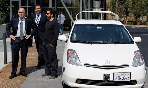 From left, California Gov. Edmund Brown, state Senator Alex Padilla and Google co-founder Sergey Brin stand by a driverless car at Google headquarters.