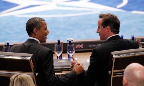 Obama and Cameron commiserate during a NATO meeting in May. Obama and Cameron commiserate during a NATO meeting in May.
