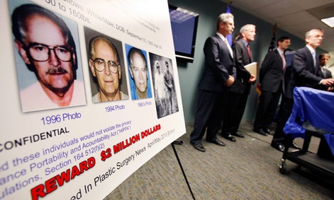 FBI special agent Richard Deslauriers, right, speaks during a news conference about their hunt for fugitives James "Whitey" Bulger and Catherine Greig in 2011.  The FBIs facial recognition app would help identify criminal suspects in the field.
