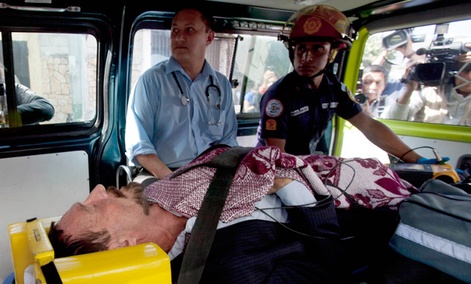 Software company founder John McAfee lies inside an ambulance, to be transferred from an immigration detention center to a hospital, in Guatemala City. Software company founder John McAfee lies inside an ambulance, to be transferred from an immigration detention center to a hospital, in Guatemala City.