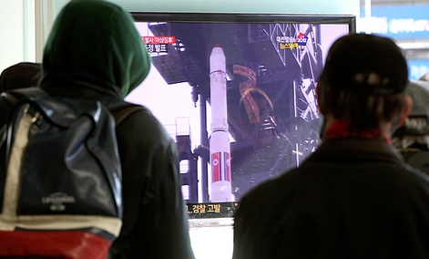 South Koreans watch a TV news program about North Korea's rocket launch plans at Seoul Railway Station in Seoul, South Korea. South Koreans watch a TV news program about North Korea's rocket launch plans at Seoul Railway Station in Seoul, South Korea.