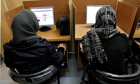 Iranian women use computers at an Internet cafe in central Tehran, Iran. Iranian women use computers at an Internet cafe in central Tehran, Iran.