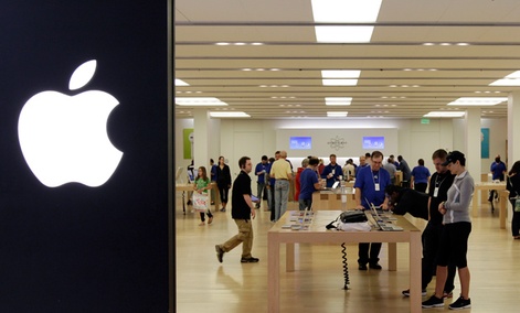 People shop in an Apple store at a mall in Cheektowaga, N.Y.