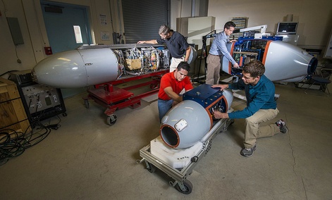 Researchers prepare pods that, airborne, will track radiation to its source and identify nuclear bombs.