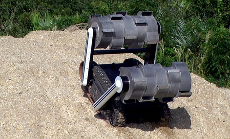 The RASSOR robot climbs a hill during recent testing at NASA's Kennedy Space Center in Florida. 