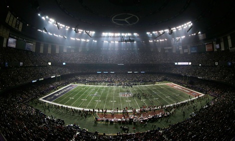 Fans and members of the Baltimore Ravens and San Francisco 49ers wait for power to return in the Superdome.