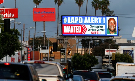 A digital billboard shows a "wanted" alert for former Los Angeles police officer Christopher Dorner. A digital billboard shows a "wanted" alert for former Los Angeles police officer Christopher Dorner.