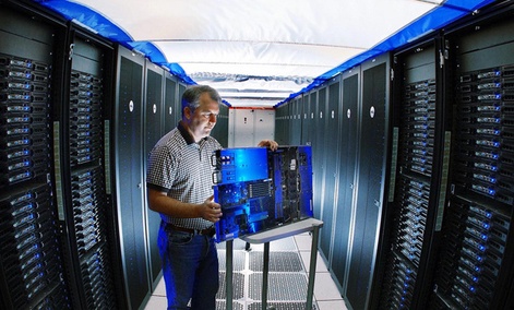 A Sandia reseracher inspects a Thunderbird supercomputer component. 
