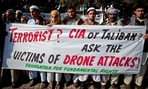Pakistani tribal villagers hold a rally to condemn U. S. drone attacks.