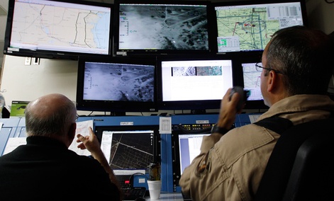 Activities of a Predator B unmanned aircraft are monitored at the Naval Air Station. Activities of a Predator B unmanned aircraft are monitored at the Naval Air Station.