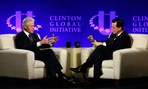 Former President Bill Clinton, left, and Comedy Central's Stephen Colbert during the Clinton Global Initiative at Washington University in St. Louis