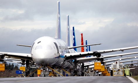 A line of Boeing 787 jets parked nose-to-tail at Paine Field in Everett, Washington. A line of Boeing 787 jets parked nose-to-tail at Paine Field in Everett, Washington.