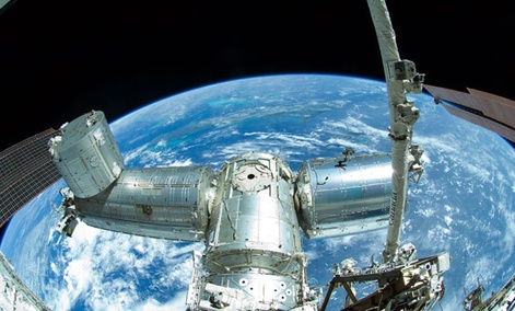 The International Space Station is seen orbiting the Earth. The International Space Station is seen orbiting the Earth.