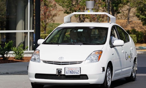 One of Google's driverless cars in action, a product of the company's X-lab One of Google's driverless cars in action, a product of the company's X-lab