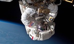 Astronaut Chris Cassidy and Tom Marshburn, not pictured, perform a space walk to inspect and replace a pump controller box on the International Space Station on May 11, 2013.