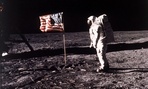 Astronaut Edwin E. "Buzz" Aldrin Jr. poses for a photograph beside the U.S. flag deployed on the moon during the Apollo 11 mission.