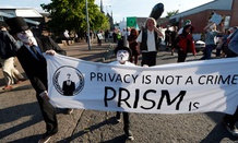 Protestors gather during a demonstration outside of the security perimeter of the G-8 summit in Enniskillen, Northern Ireland Monday.