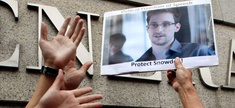 A supporter holds a picture of Edward Snowden, outside the U.S. Consulate General in Hong Kong. 