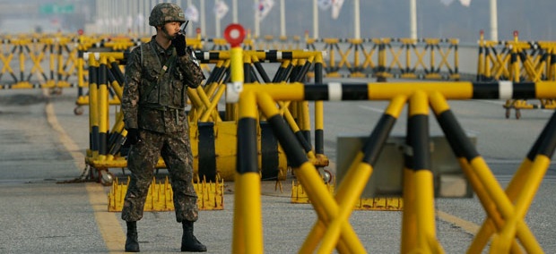 A South Korean soldier uses his radio at Unification Bridge. A South Korean soldier uses his radio at Unification Bridge.