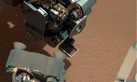 This image from the right Mast Camera (Mastcam) of NASA's Mars rover Curiosity shows a scoop full of sand and dust lifted by the rover's first use of the scoop on its robotic arm. This image from the right Mast Camera (Mastcam) of NASA's Mars rover Curiosity shows a scoop full of sand and dust lifted by the rover's first use of the scoop on its robotic arm.