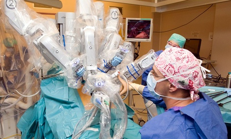 The da Vinci surgical robot system in action during a surgery. The da Vinci surgical robot system in action during a surgery.