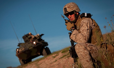 Marine Corps Staff Sgt. Brian Sears relays an update to his platoon commander during an exercise at Camp Pendleton, Calif. Marine Corps Staff Sgt. Brian Sears relays an update to his platoon commander during an exercise at Camp Pendleton, Calif.