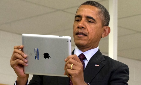 Barack Obama holds an iPad at an event at a Maryland school in February. Barack Obama holds an iPad at an event at a Maryland school in February.
