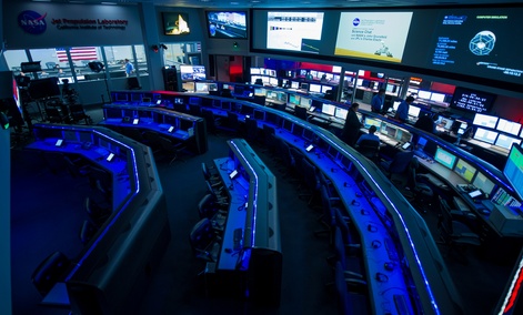 The the control rooms at the Jet Propulsion Laboratory, the Dark Room in the foreground, Deep Space Network control room on the right and the Mars Science Laboratory Mission Support Area back left. The the control rooms at the Jet Propulsion Laboratory, the Dark Room in the foreground, Deep Space Network control room on the right and the Mars Science Laboratory Mission Support Area back left.