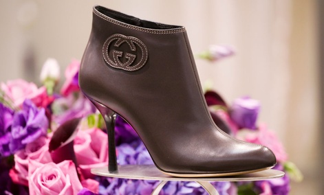 A stiletto-heeled leather shoe by Gucci is displayed on Saks Fifth Avenue's designer shoe floor. A stiletto-heeled leather shoe by Gucci is displayed on Saks Fifth Avenue's designer shoe floor.