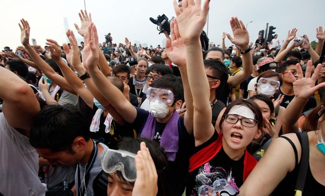 Pro-democracy student protesters confront police outside of the Chief Executive office in the government complex in Hong Kong. Pro-democracy student protesters confront police outside of the Chief Executive office in the government complex in Hong Kong.