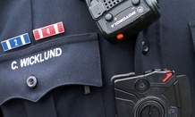 Sgt. Chris Wicklund of the Burnsville, Minn. Police Department wears a body camera beneath his microphone.
