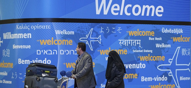 Passengers walk out of an entrance after their arrival at Terminal 4 at John F. Kennedy International Airport in New York, Sunday, Feb. 5, 2017. Passengers walk out of an entrance after their arrival at Terminal 4 at John F. Kennedy International Airport in New York, Sunday, Feb. 5, 2017.