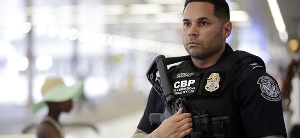 A U.S. Customs and Border Protection officer patrols outside of the departures area at Miami International Airport, Friday, July 1, 2016. A U.S. Customs and Border Protection officer patrols outside of the departures area at Miami International Airport, Friday, July 1, 2016.