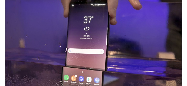A Samsung Galaxy S8 mobile phone is shown partially submerged to demonstrate its water resistance, in New York, Friday, March 24, 2017. A Samsung Galaxy S8 mobile phone is shown partially submerged to demonstrate its water resistance, in New York, Friday, March 24, 2017.