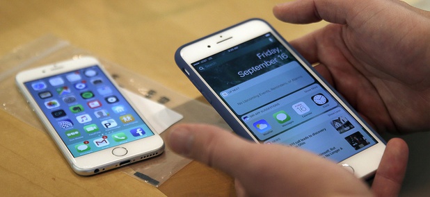 A customer sets up his new iPhone 7 Plus, right, as he switches from an iPhone 6 at the Apple Store in Chicago. A customer sets up his new iPhone 7 Plus, right, as he switches from an iPhone 6 at the Apple Store in Chicago.