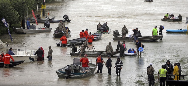 Rescue boats fill Tidwell Road as they help flood victims evacuate as floodwaters from Tropical Storm Harvey rise Monday, Aug. 28, 2017, in Houston. Rescue boats fill Tidwell Road as they help flood victims evacuate as floodwaters from Tropical Storm Harvey rise Monday, Aug. 28, 2017, in Houston.
