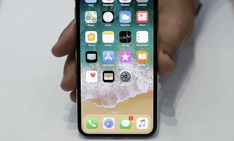 The new iPhone X is displayed in the showroom after the new product announcement at the Steve Jobs Theater on the new Apple campus on Tuesday, Sept. 12, 2017, in Cupertino, Calif. The new iPhone X is displayed in the showroom after the new product announcement at the Steve Jobs Theater on the new Apple campus on Tuesday, Sept. 12, 2017, in Cupertino, Calif.