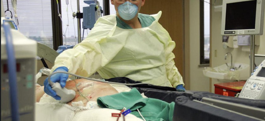 Dr. Kevin Chung treats a burn patient at Brooke Army Medical Center in San Antonioin 2007.