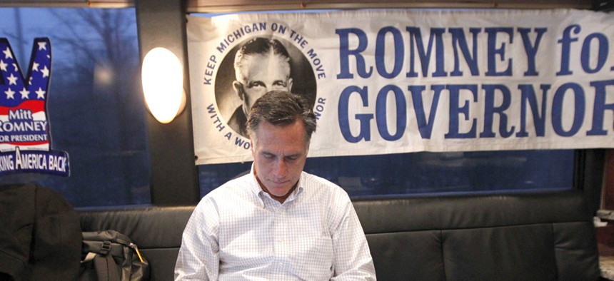 Mitt Romney uses his iPad on a bus tour in February.