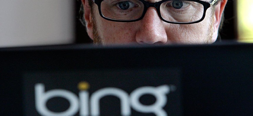 Microsoft vendor Patrick Porter works on a laptop marked with the logo for Bing, the company's search engine.