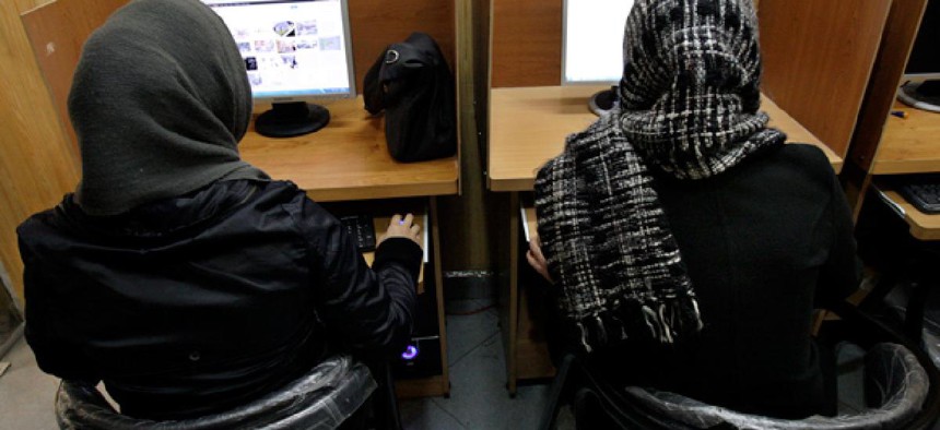 Iranian women use computers at an Internet cafe in central Tehran, Iran.