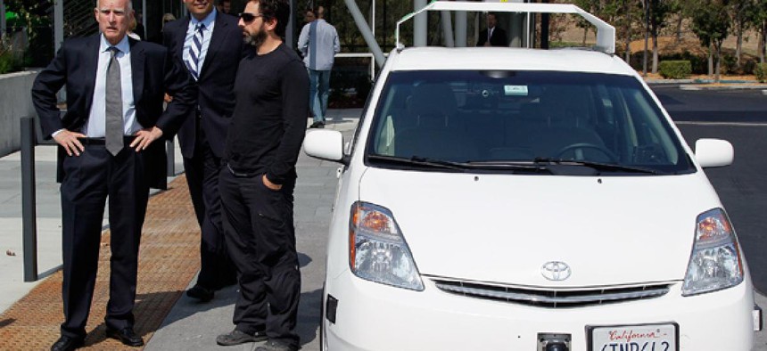 From left, California Gov. Edmund Brown, state Senator Alex Padilla and Google co-founder Sergey Brin stand by a driverless car at Google headquarters.
