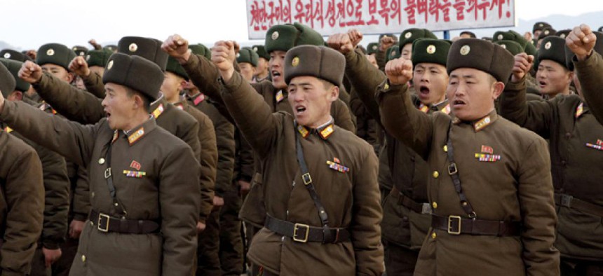 In this Nov. 23, 2012 photo, North Korean soldiers vow to retaliate against any South Korean military action during a rally in South Hwanghae Province.