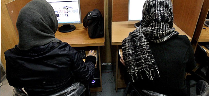 Iranian women use computers at an Internet cafe in central Tehran, Iran.